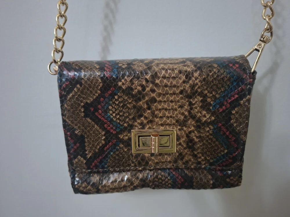 deja vu Clutches & Evening Bags