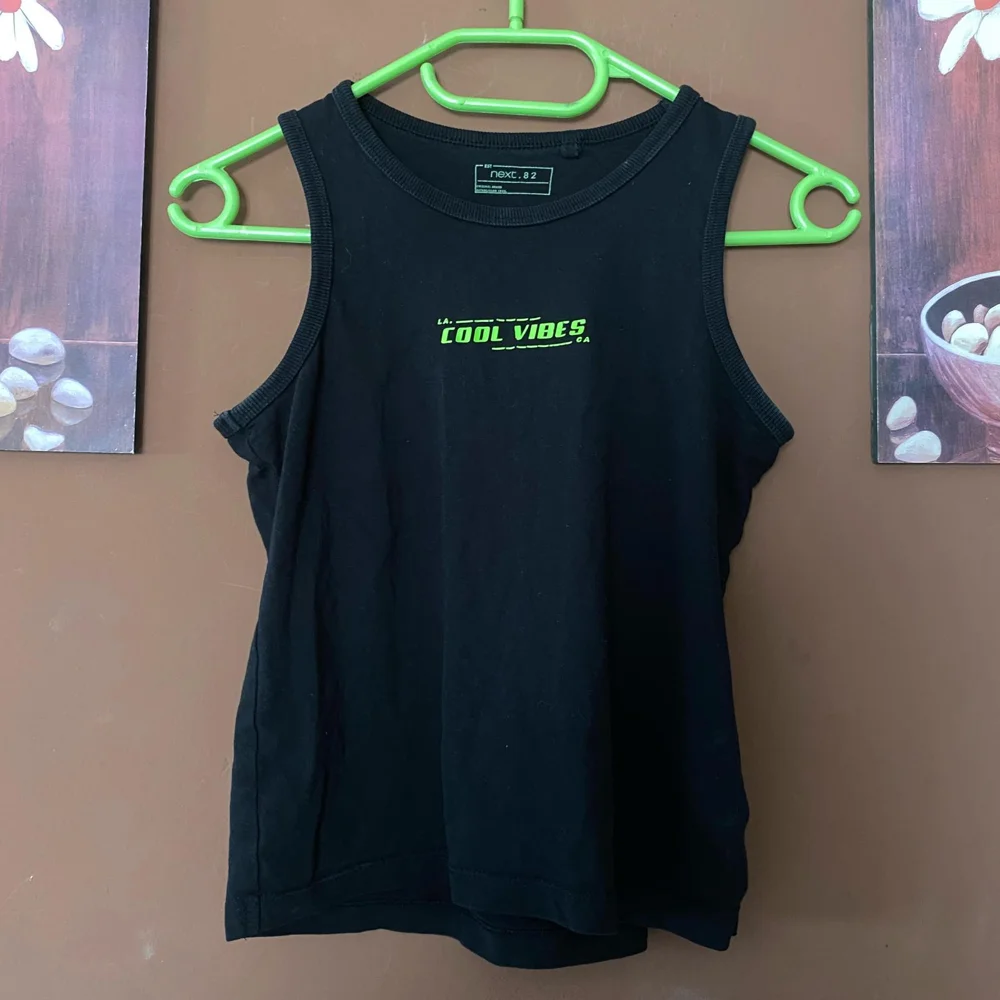 Next Tank Tops